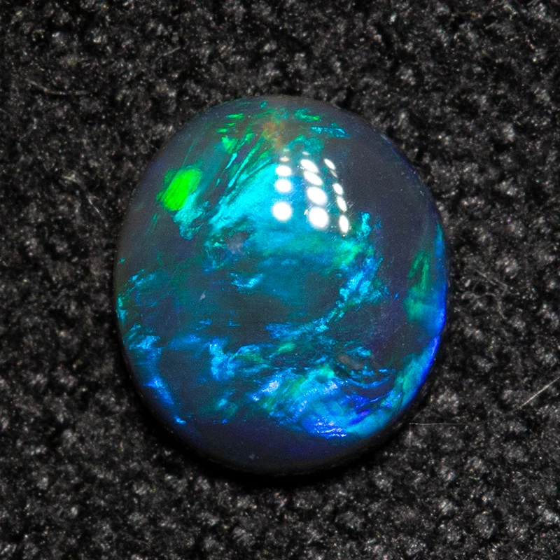 0.24 ct black opal 5.1x4.5x1.5mm