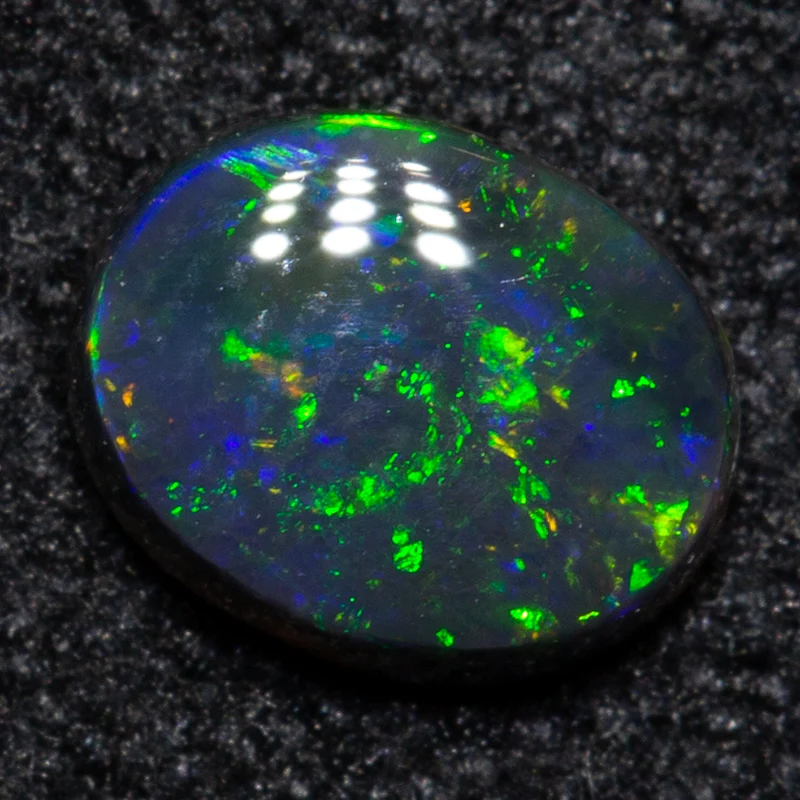 0.33 ct black opal 5.4x4.2x2mm
