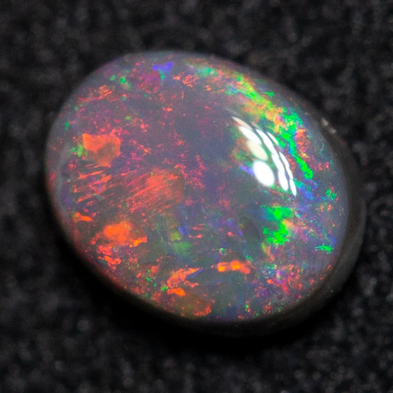 0.36 ct black opal 5.4x4.2x2.3mm