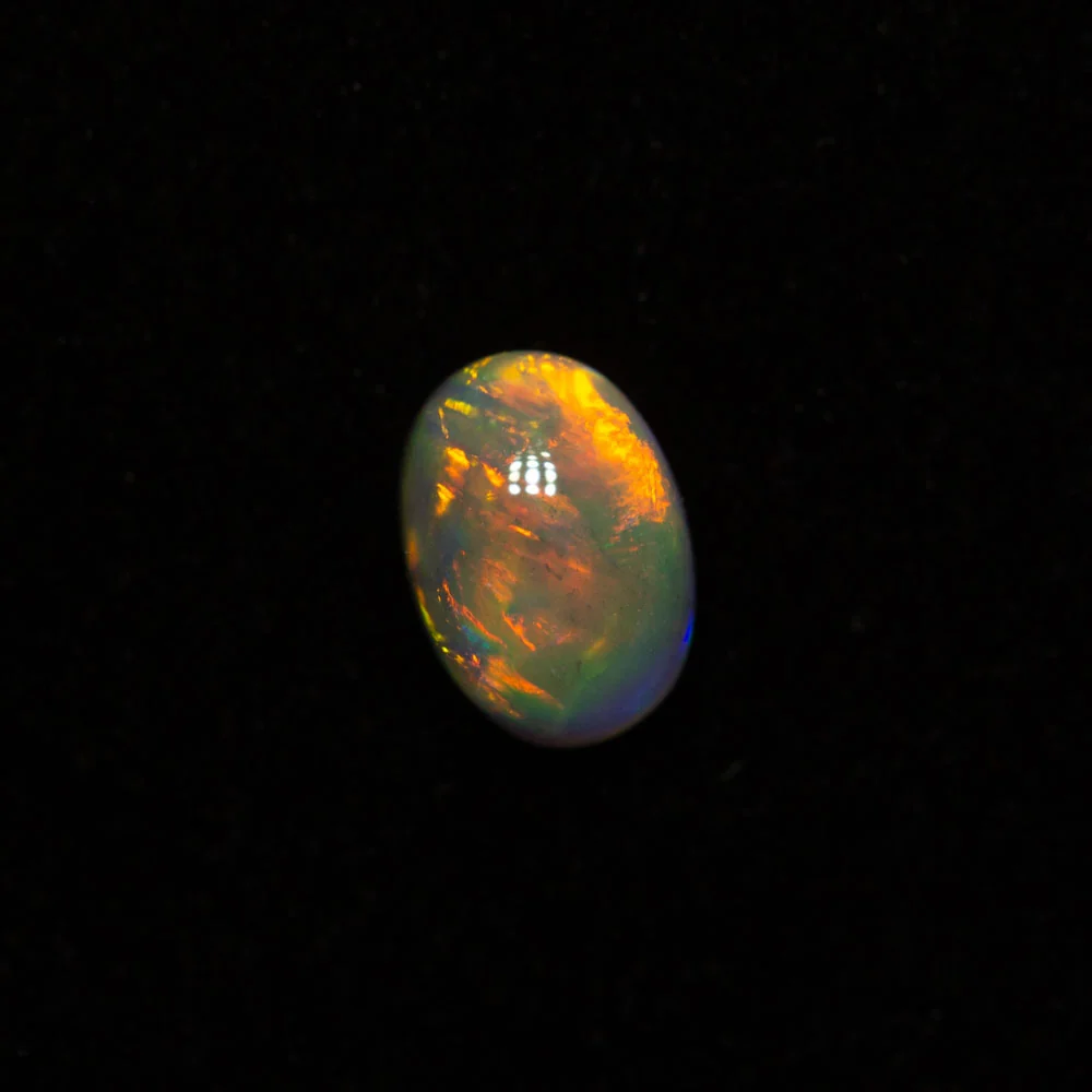 0.40 ct dark opal 5.9x4.2x2.6mm