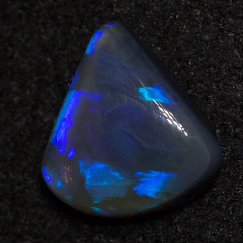 0.49 ct black opal 6.4x5.7x2.1mm