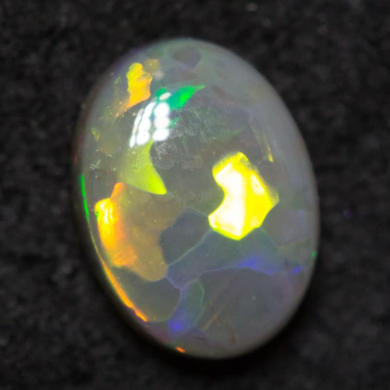 0.50 ct black opal 6.4x4.7x2.5mm