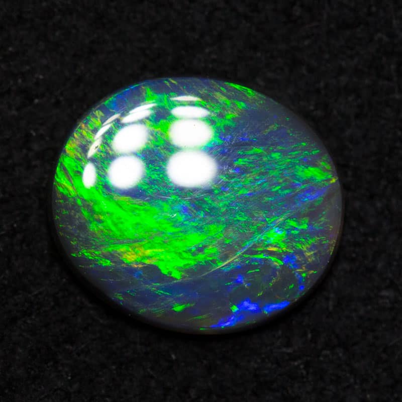 0.51 ct black opal 7.1x6.2x1.7mm