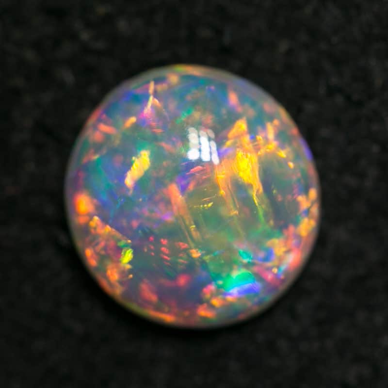 0.54 ct gem crystal opal 6mm round x2mm