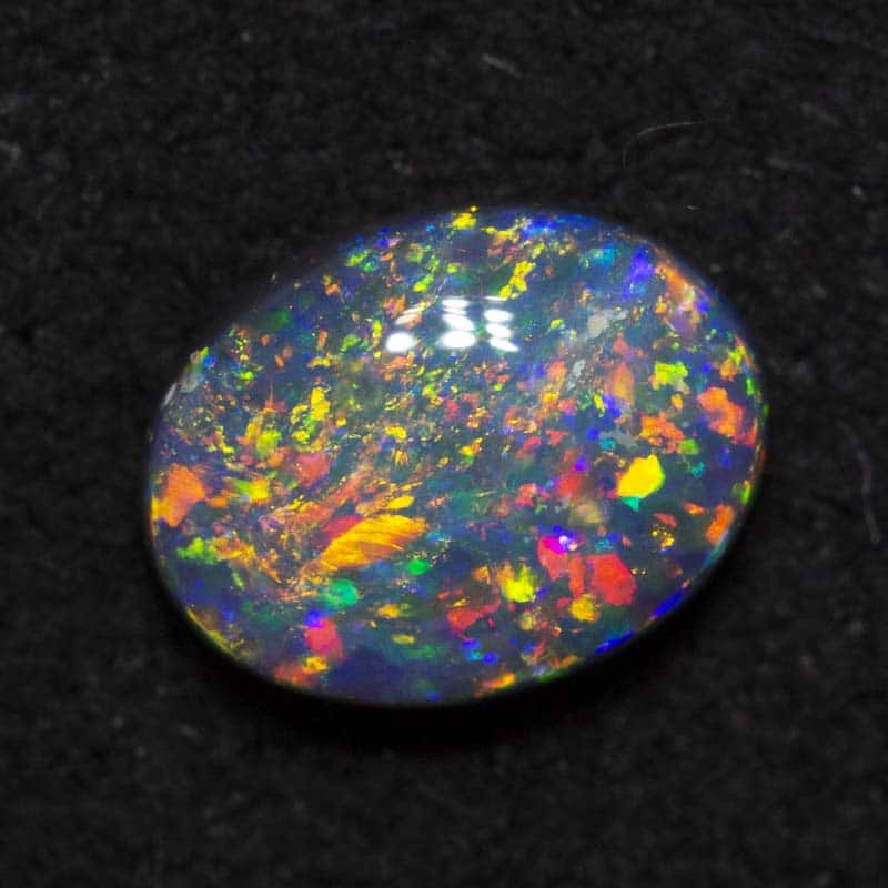0.57 ct black opal 6.7x5.2x2.6mm