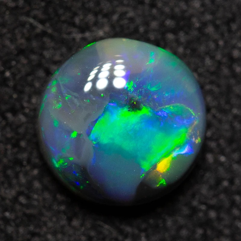 0.60 ct black opal 5.6x5.6x2.7mm