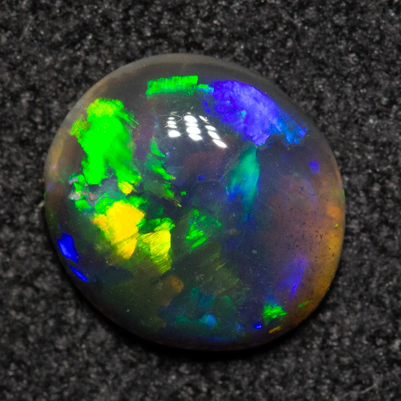 0.62 ct black opal 6.9x6.4x2.4mm