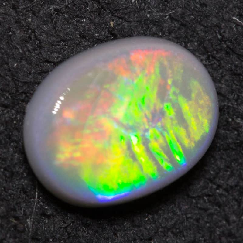 0.64 ct dark opal 7.3x5.4x2.3mm