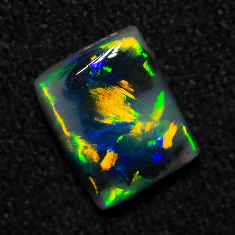 0.66 ct dark opal 6.3x5.1x2.4mm