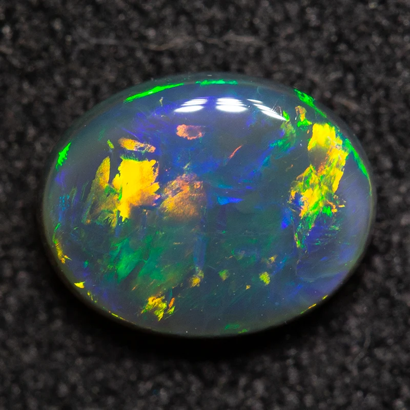 0.70 ct black opal 6.9x5.4x2.7mm - Image 2