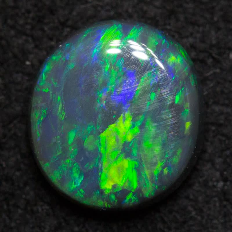 0.73 ct black opal 6.5x5.9x2.7mm