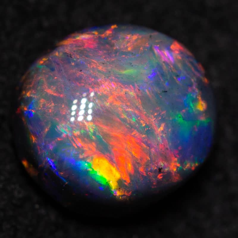 0.74 ct gem black opal 6x5.5x3.2mm