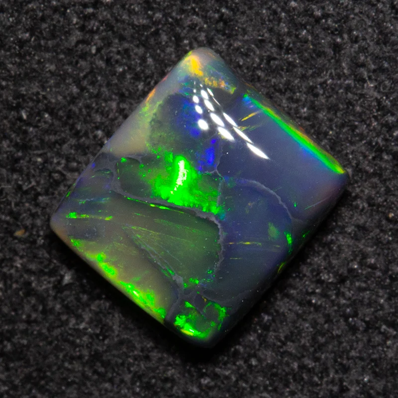 0.82 ct black opal 6.3x5.7x2.7mm