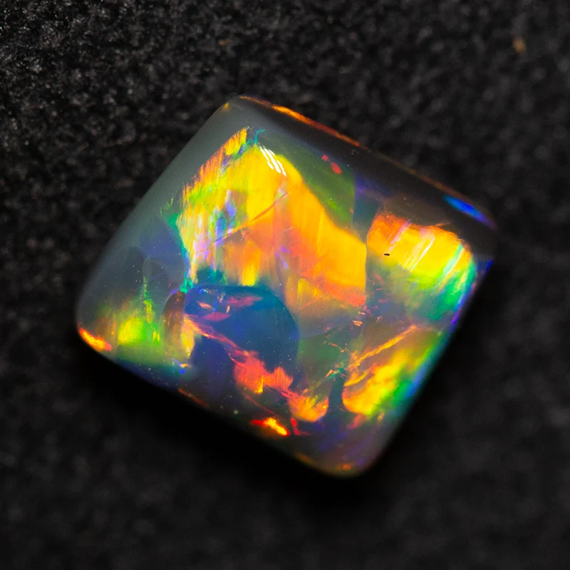 0.82 ct double-sided black opal 6.1x5.4x3.4mm