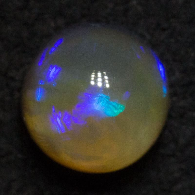 0.84 ct dark opal 5.1x5.1x4.6mm