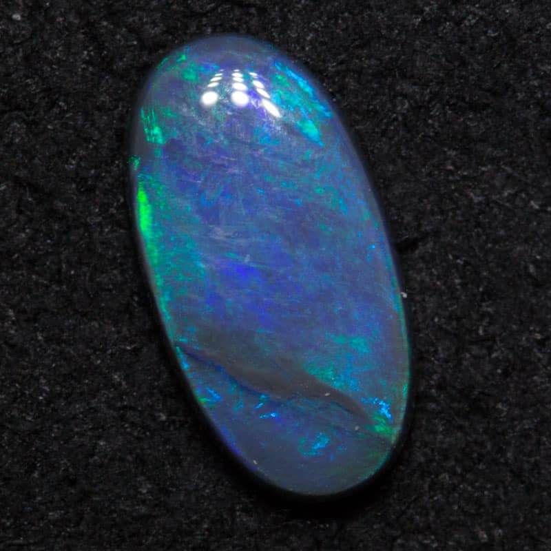 0.85 ct black opal 9.7x5.1x2.3mm