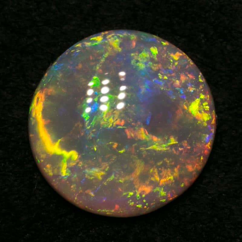 0.86 ct crystal opal 7mm round x2mm
