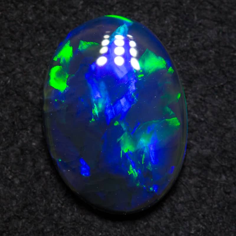 0.87 ct black opal 9x6.7x2.1mm