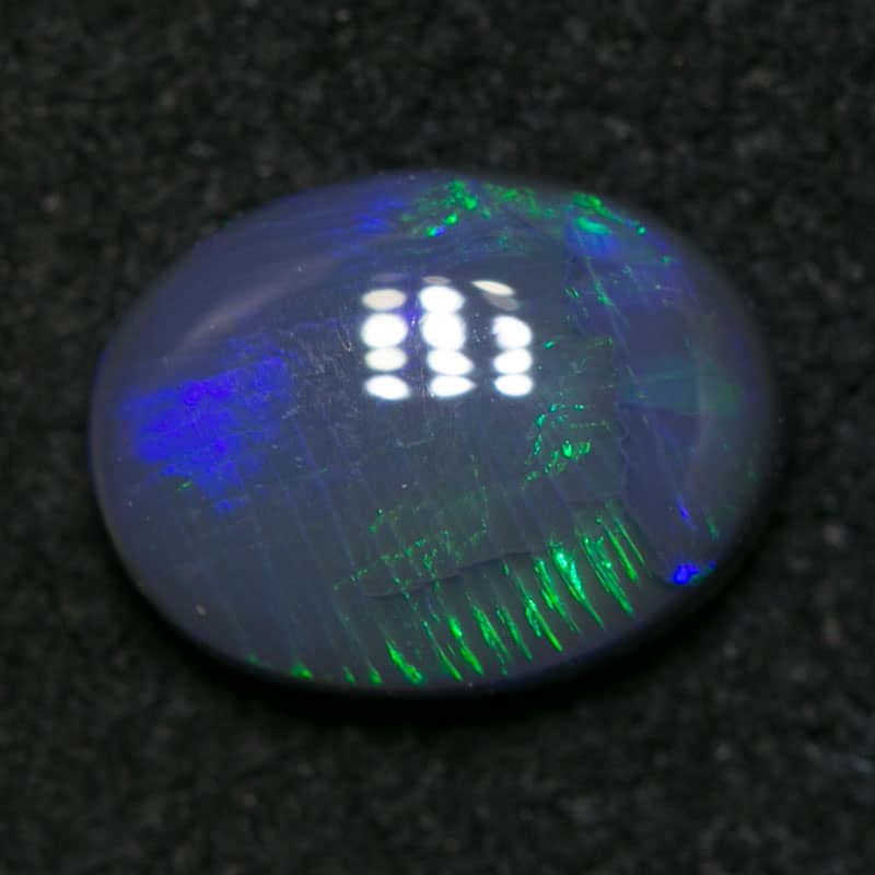 0.88 ct black opal 7x6x3mm - Image 4