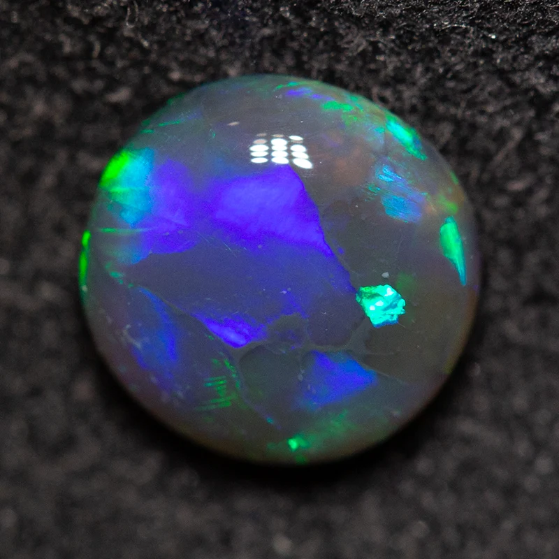 0.90 ct black opal 6.9x6.8x3.1mm
