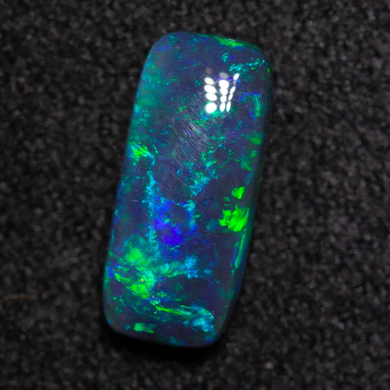 0.94 ct black opal 9.6x4.2x2.9mm