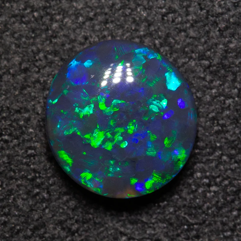1.01 ct black opal 7.1x6.8x3.4mm