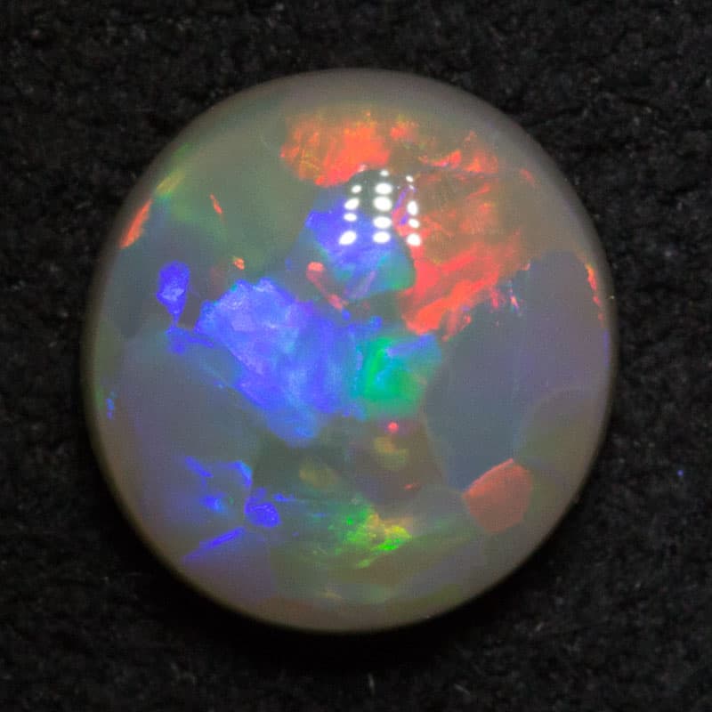 1.28 ct dark opal 7.8x7.4x3.3mm