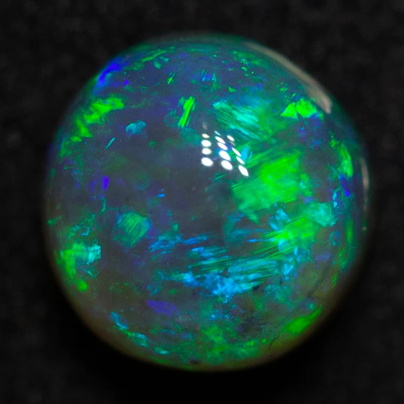 1.36 ct dark crystal opal 6.6x6.4x5.3mm