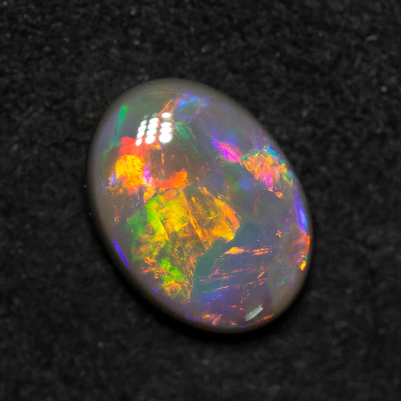 1.56 ct dark opal 9.6x7.1x3.6mm
