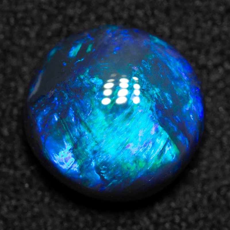 1.57 ct black opal 7.8x7.7x4mm