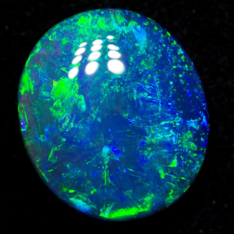 10.59 ct gem black opal 16.5x14.5x6.6mm