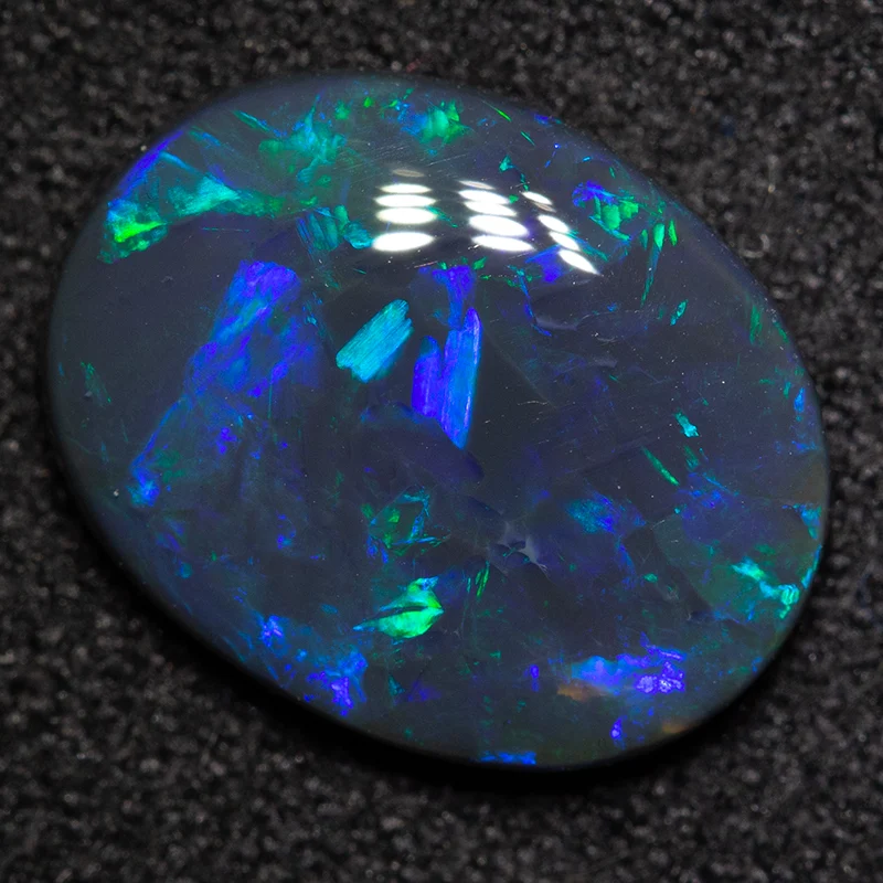 2.27 ct black opal 12.2x9.5x3.1mm