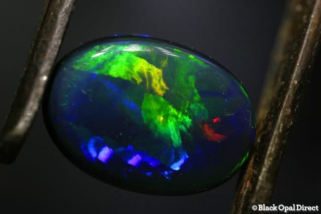 3.22 ct gem flag harlequin pattern black opal 12x9x4.5mm