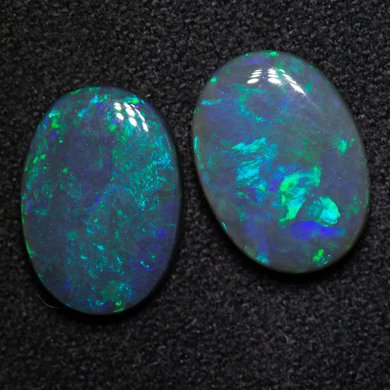 3.67 ct black opal pair 11.1x7.9x3.2mm