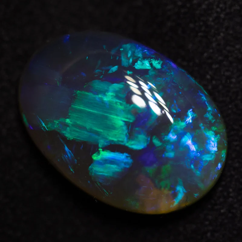 5.47 ct black crystal opal 14.5x10.2x5.8mm
